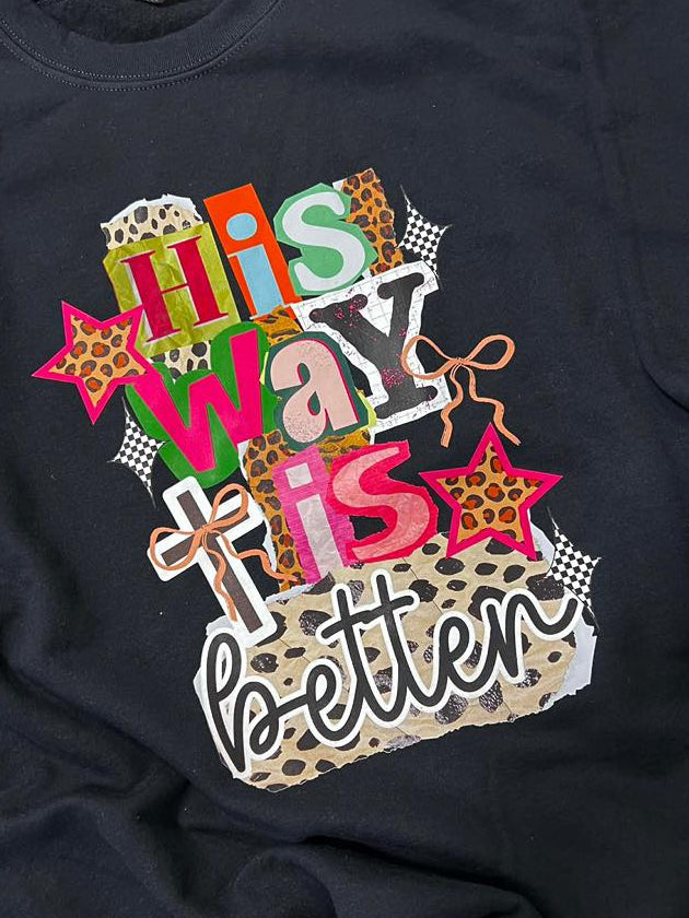 Black sweatshirt with colorful His Way is Better text design with cross and bow on a plain black background