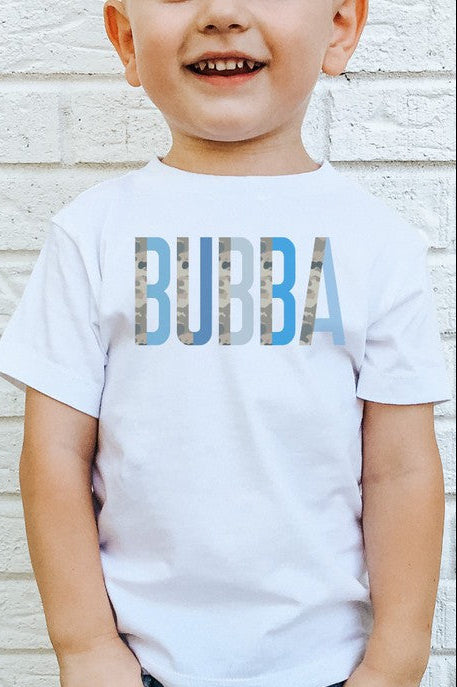 A child wearing a white short-sleeved t-shirt with the text 'BUBBA' printed in blue camo colorblock style on the front.